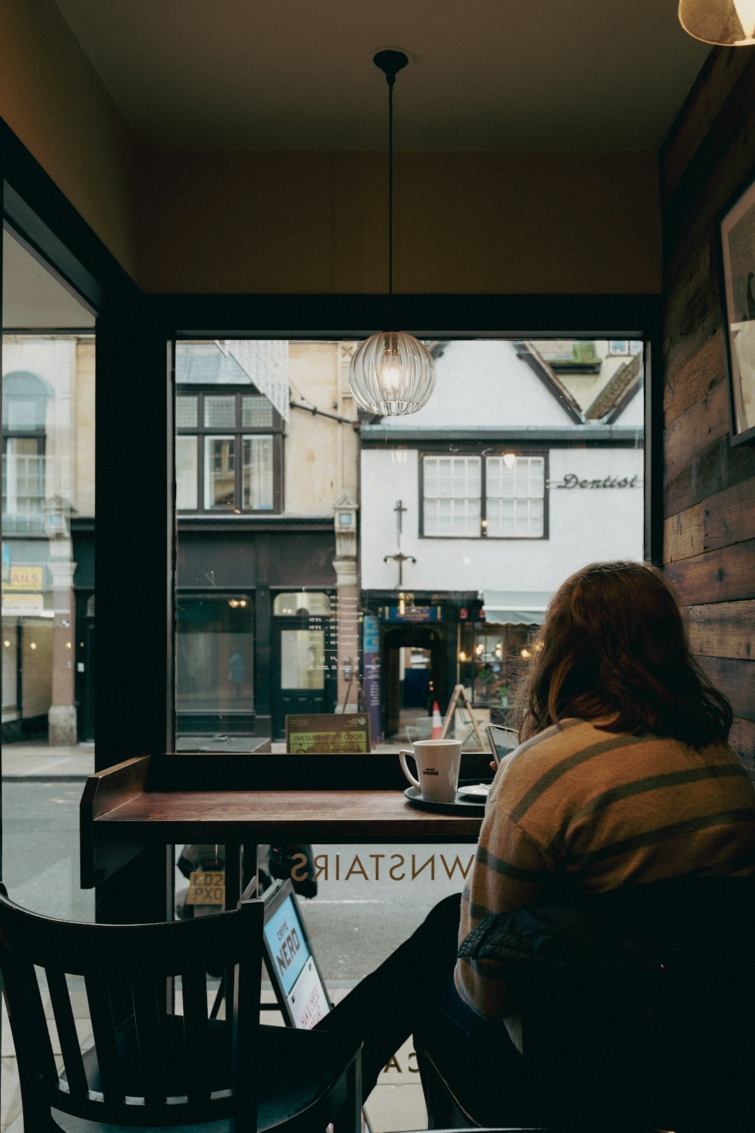 writer observing people in cafe